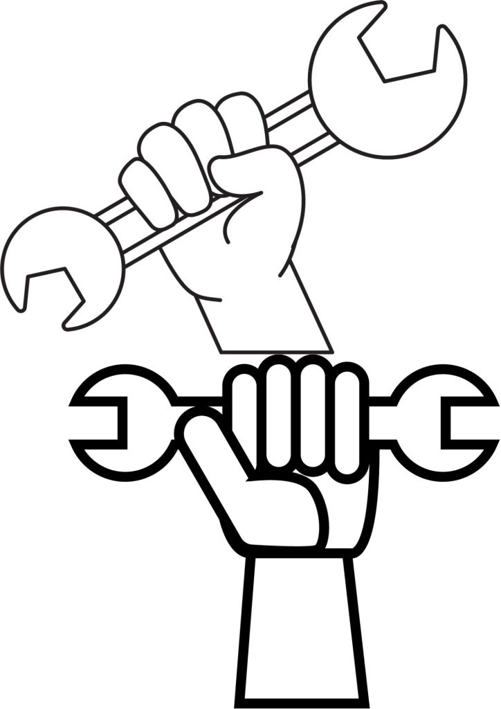 Hand holding a spanner